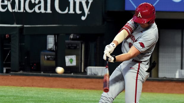 Ben McLaughlin gets a hit for the Razorbacks against Michigan